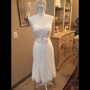 Ivory knee length wedding dress.